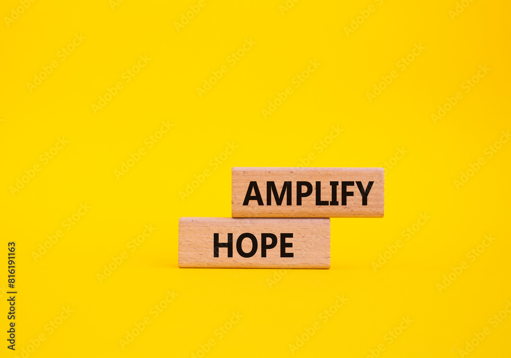 Amplify Hope symbol. Wooden blocks with words Amplify Hope. Beautiful yellow background. Business and Amplify Hope concept. Copy space. Amplify Hope symbol. Wooden blocks with words Amplify Hope. Beautiful yellow background. Business and Amplify Hope concept. Copy space.