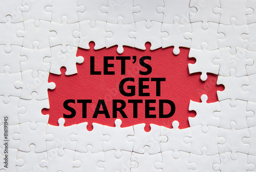 Lets get started symbol. Concept words Lets get started on white puzzle. Beautiful red background. Business and Lets get started concept. Copy space.