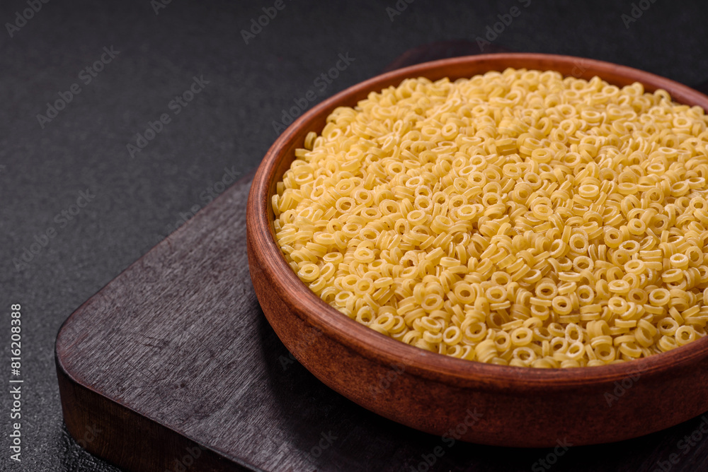 Raw anellini pasta from durum wheat with salt and spices Raw anellini pasta from durum wheat with salt and spices