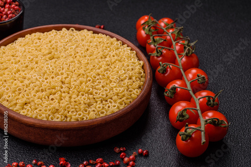 Raw anellini pasta from durum wheat with salt and spices photo