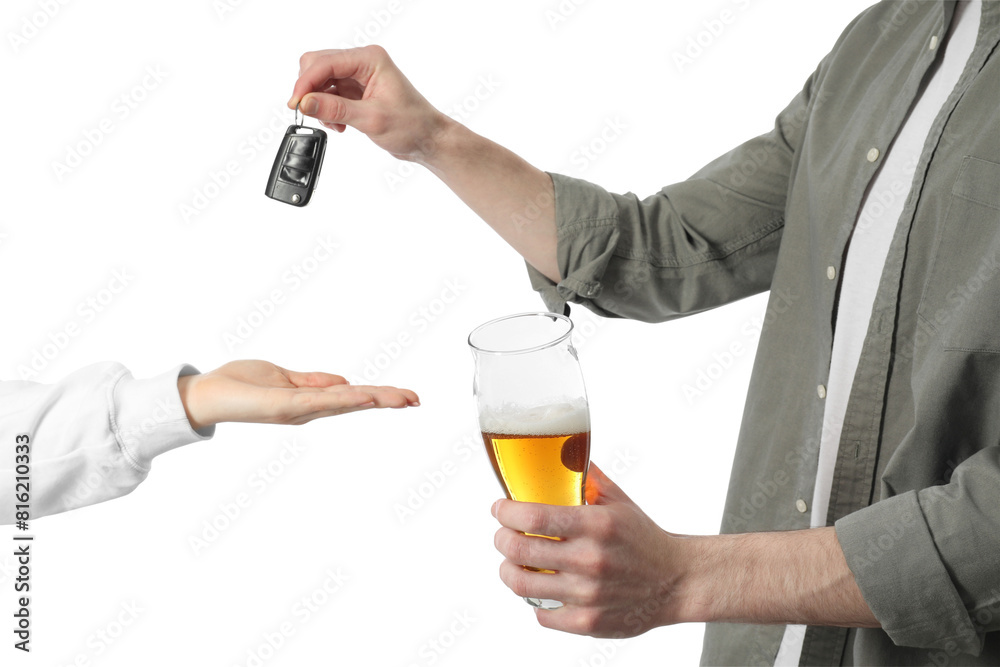 Man with glass of alcoholic drink giving car key to woman on white background, closeup. Don't drink and drive concept Man with glass of alcoholic drink giving car key to woman on white background, closeup. Don't drink and drive concept