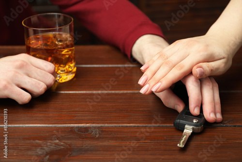Woman stopping drunk man from taking car keys  closeup. Don t drink and drive concept