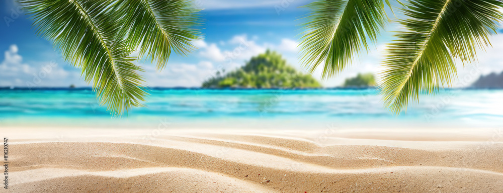 A serene tropical beach with clear blue water, white sand, and palm fronds framing an island in the distance. The calm ocean meets the pristine sandy shore, creating a paradise-like vacation spot.