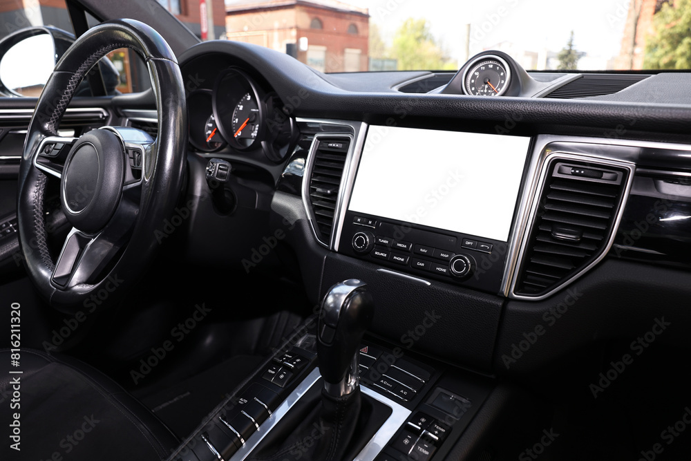 Steering wheel and dashboard inside of modern black car, closeup Steering wheel and dashboard inside of modern black car, closeup