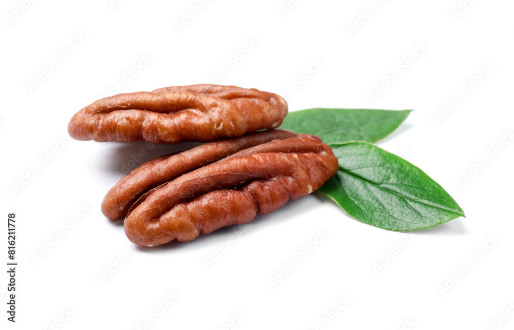 Tasty pecan nuts with green leaves isolated on white Tasty pecan nuts with green leaves isolated on white