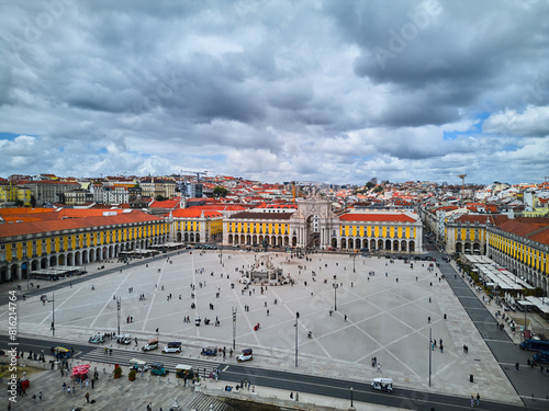 Aerial view of Lisbon, Portugal. View of the famous Commercial Square and Augusta Arch on a sunny day with fluffy clouds