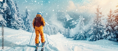 Skier descending snowy mountain photo