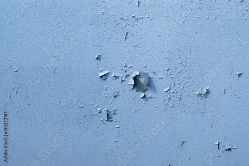 Texture of cracked peeling blue paint