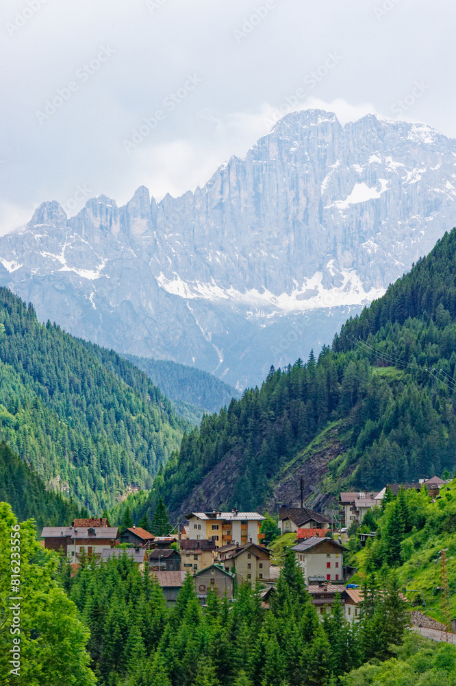Obraz premium Small rural village nestled in the Dolomite Mountains Italy.Green morning scene of countryside in Swiss Alps, Bernese italian in the canton of Bern, Switzerland, Europe. Alpine mountain pasture
