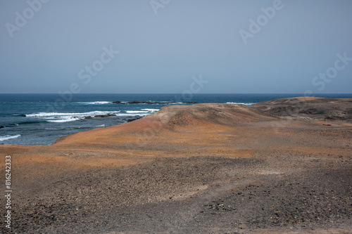 Arid, volcanic landscape of the southern side of Jandia Nature Reserve, Jandia Peninsula, Fuerteventura, Spain
