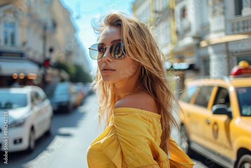 A beautiful woman calling Uber taxi in the city