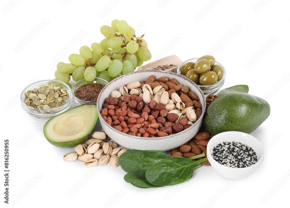 Different nuts, seeds and products high in healthy fats isolated on white Different nuts, seeds and products high in healthy fats isolated on white