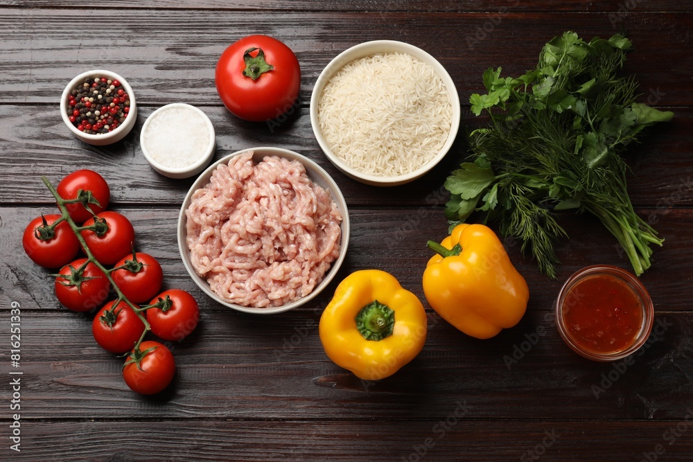 Making stuffed peppers. Ground meat and other ingredients on wooden table, flat lay Making stuffed peppers. Ground meat and other ingredients on wooden table, flat lay