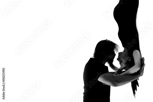 Beautiful pregnant woman and her handsome husband are kissing while spending time together isolated over white background wall. beautiful young couple expecting baby standing together and touching