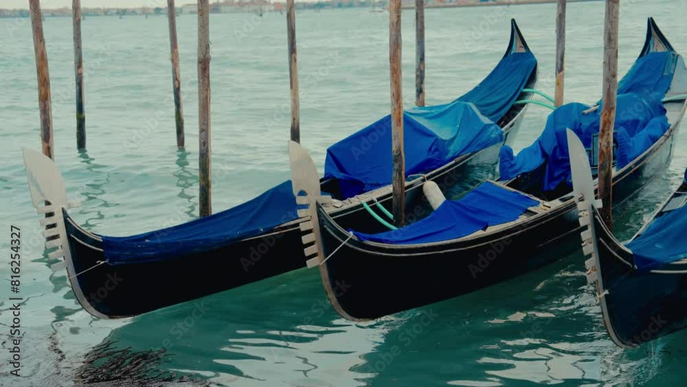 Gondolas At Rest Between Wooden Poles Gondolas At Rest Between Wooden Poles