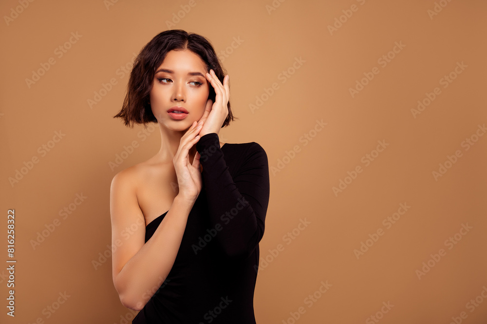 Photo of cute charming lady wear off shoulder black bodysuit prepare event empty space isolated beige color background Photo of cute charming lady wear off shoulder black bodysuit prepare event empty space isolated beige color background