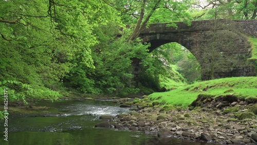 Slow motion footage of the River Dane flowing through Danebridge in the Peak District National Park. photo
