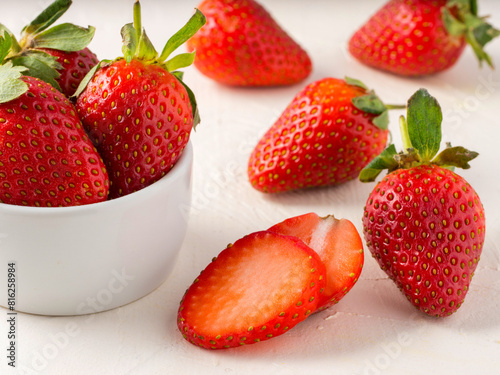 Fresh ripe strawberries in small white bowl. Strawberry in bowl on oriental white background