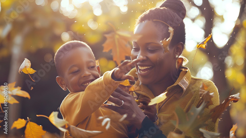 Happy african american mother and son throwing leaves in garden motherhood childhood togetherness autumn and leisure unaltered : Generative AI photo