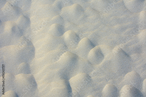 wavy patterns on the sand formed by the wind on the beach