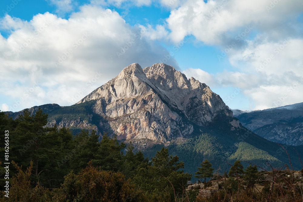 Pedraforca is an emblematic mountain of Catalonia located in the Cadi mountain range. A mountain that has two peaks separated by a large col. Landscape and background photography in spring. Pedraforca is an emblematic mountain of Catalonia located in the Cadi mountain range. A mountain that has two peaks separated by a large col. Landscape and background photography in spring.