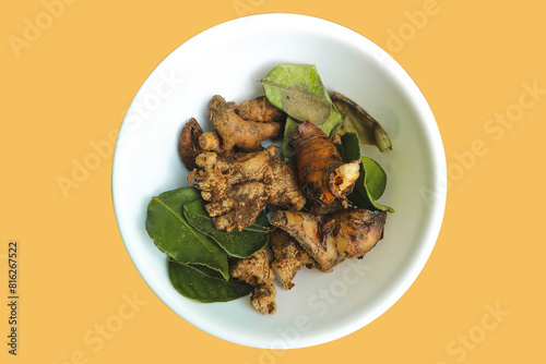 Kitchen spices in white bowl isolated on plain color background.