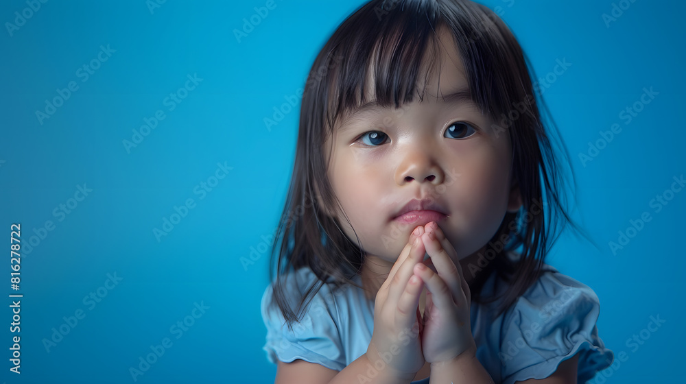 Image of Asian child posing on blue background : Generative AI Image of Asian child posing on blue background : Generative AI