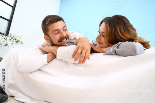 Happy couple in love lying ...