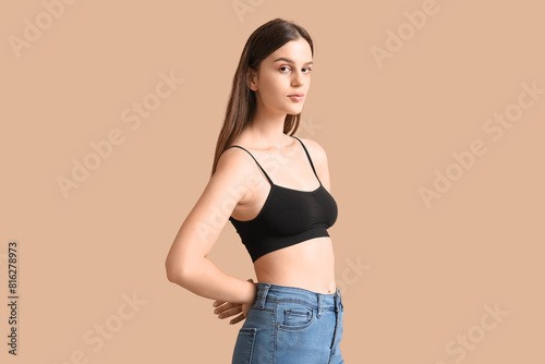 Body positive woman on beig...