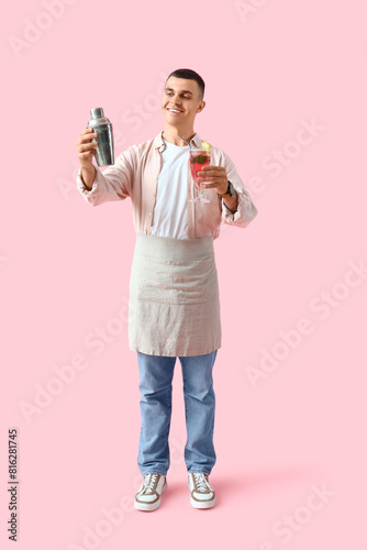 Young male bartender with g...