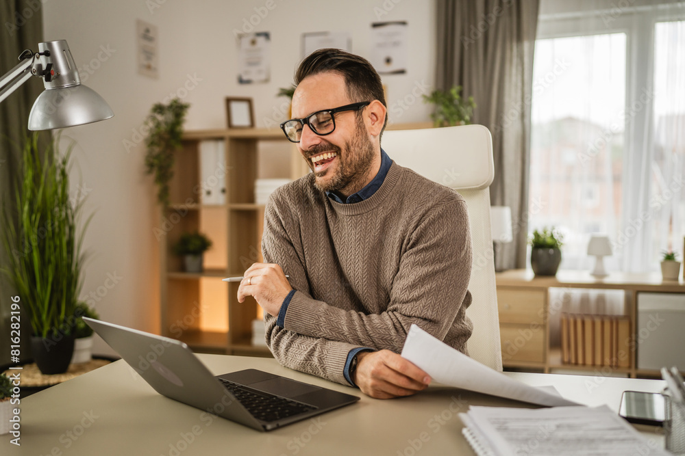 Adult man sit and hold contract have consultation via video call Adult man sit and hold contract have consultation via video call