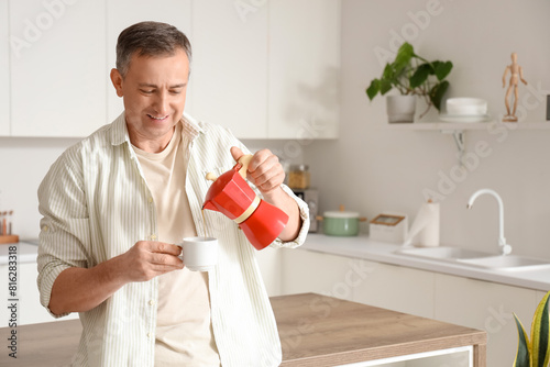 Mature man pouring espresso...