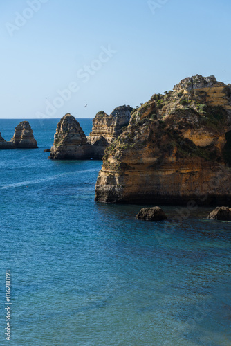 Praia de Dona Ana beach near Lagos town, Algarve, Portugal. Praia Dona Ana beach with turquoise sea water and cliffs, Portugal.