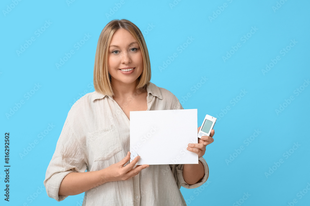 Woman with glucometer, sensor for measuring blood sugar level and blank paper on blue background. Diabetes concept Woman with glucometer, sensor for measuring blood sugar level and blank paper on blue background. Diabetes concept