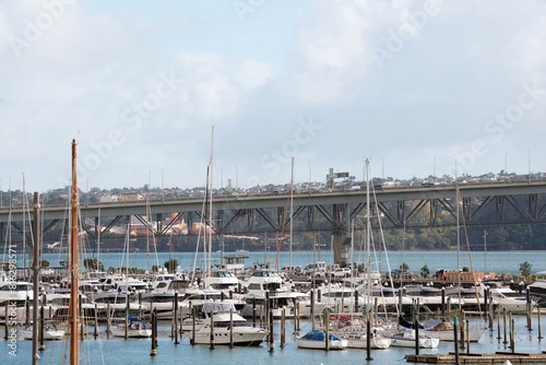 many boats in marina in front of the harbour bridge, auckland, new zealand, may 2024 © Louis