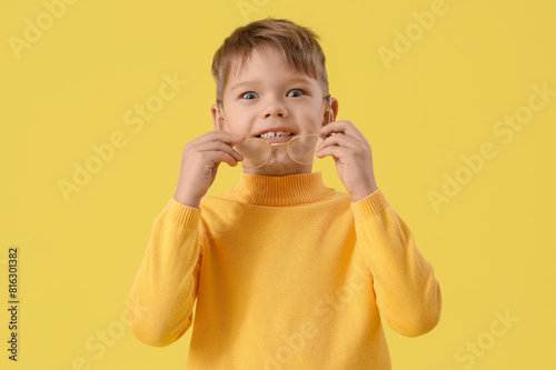 Cute little boy with eyegla...