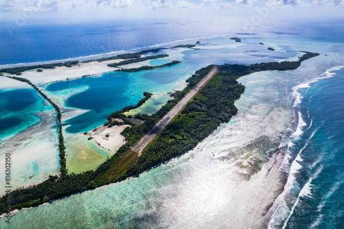 Aerial shot of Palmyra Atoll with islands, reef, lagoon, causeways and surrounding ocean	 photo