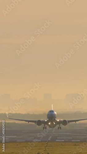 Airplane taking off. Vertical video. 