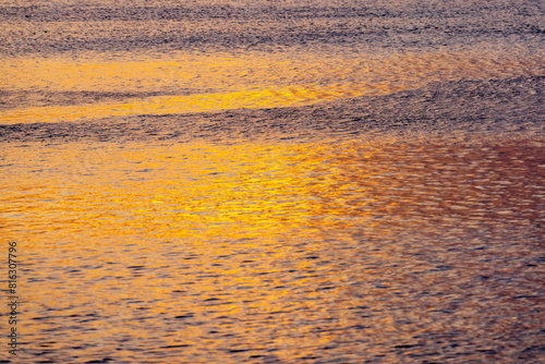 Corrente marina con mare calmo con i colori del tramonto  photo