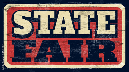 Aged retro state fair sign on wood