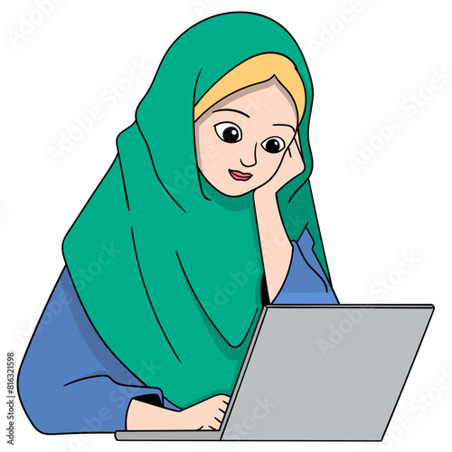 Muslim woman sitting working using a laptop