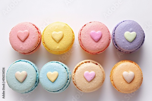 Colorful Macarons Arranged in a Row, Each with a Heart Shaped Decoration on Top