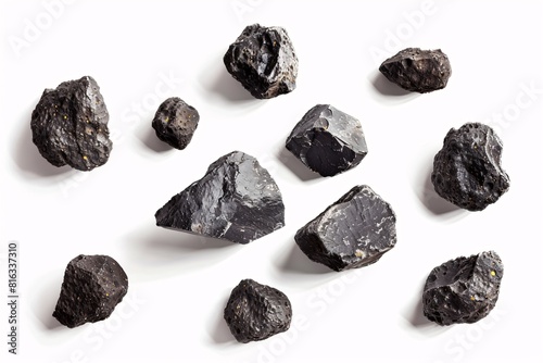 Obraz na płótnie Coal Sample: A Collection of Black Coal Lumps on a White Background w salonie