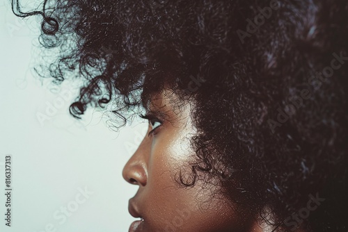 Obraz na płótnie Stylized Portrait of Woman with Curly Hair and Glowing Skin w salonie