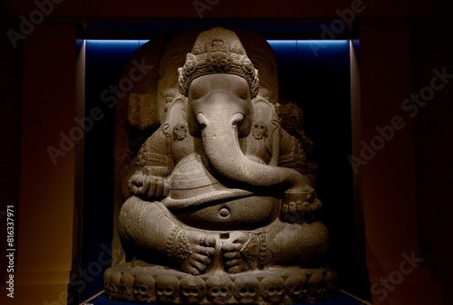 BANGKOK, THAILAND - MAY 16, 2024: Ganesha Statue seated on a human skull Carved from volcanic rock located in National Museum Bangkok (Phranakorn) at Thailand.