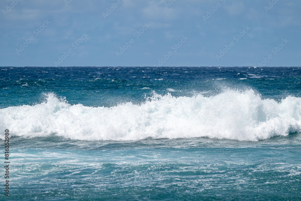 White foam and spray of a crashing wave on the beautiful blue clean Pacific Ocean off the coast of Maui, Hawaii, as a nature background
White foam and spray of a crashing wave on the beautiful blue clean Pacific Ocean off the coast of Maui, Hawaii, as a nature background