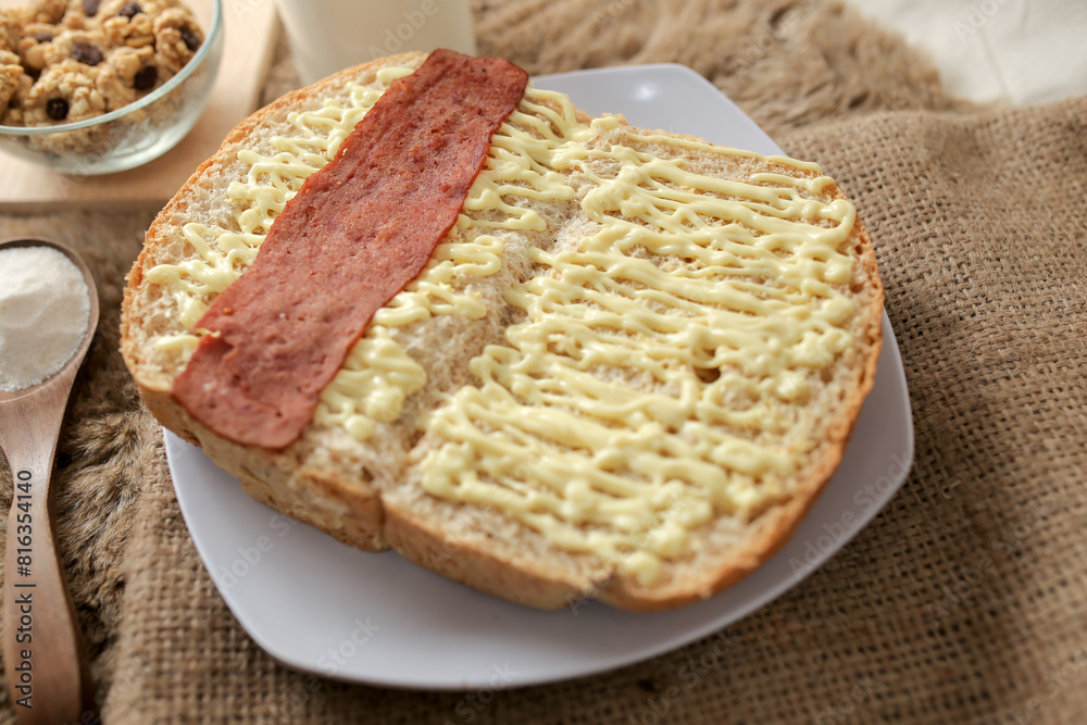 Bread with smoked beef on a plate for breakfast and coffee break Bread with smoked beef on a plate for breakfast and coffee break