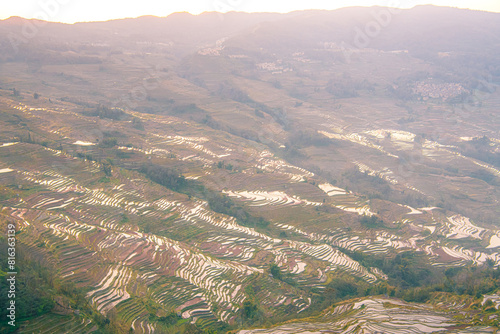 Yuan Yang Rice Terraces - Bada under the sunset in Yunnan province of China. photo