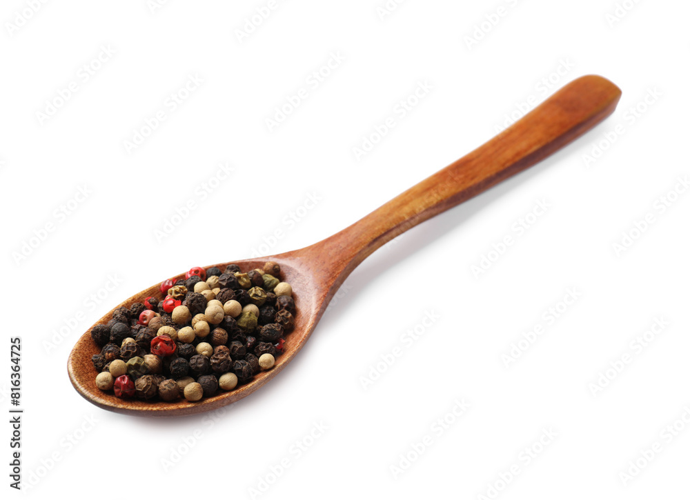 Aromatic spices. Different peppers in wooden spoon isolated on white Aromatic spices. Different peppers in wooden spoon isolated on white
