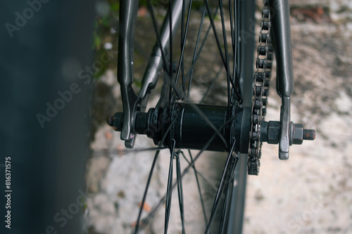 bicycle black wheel, chain, and hub 